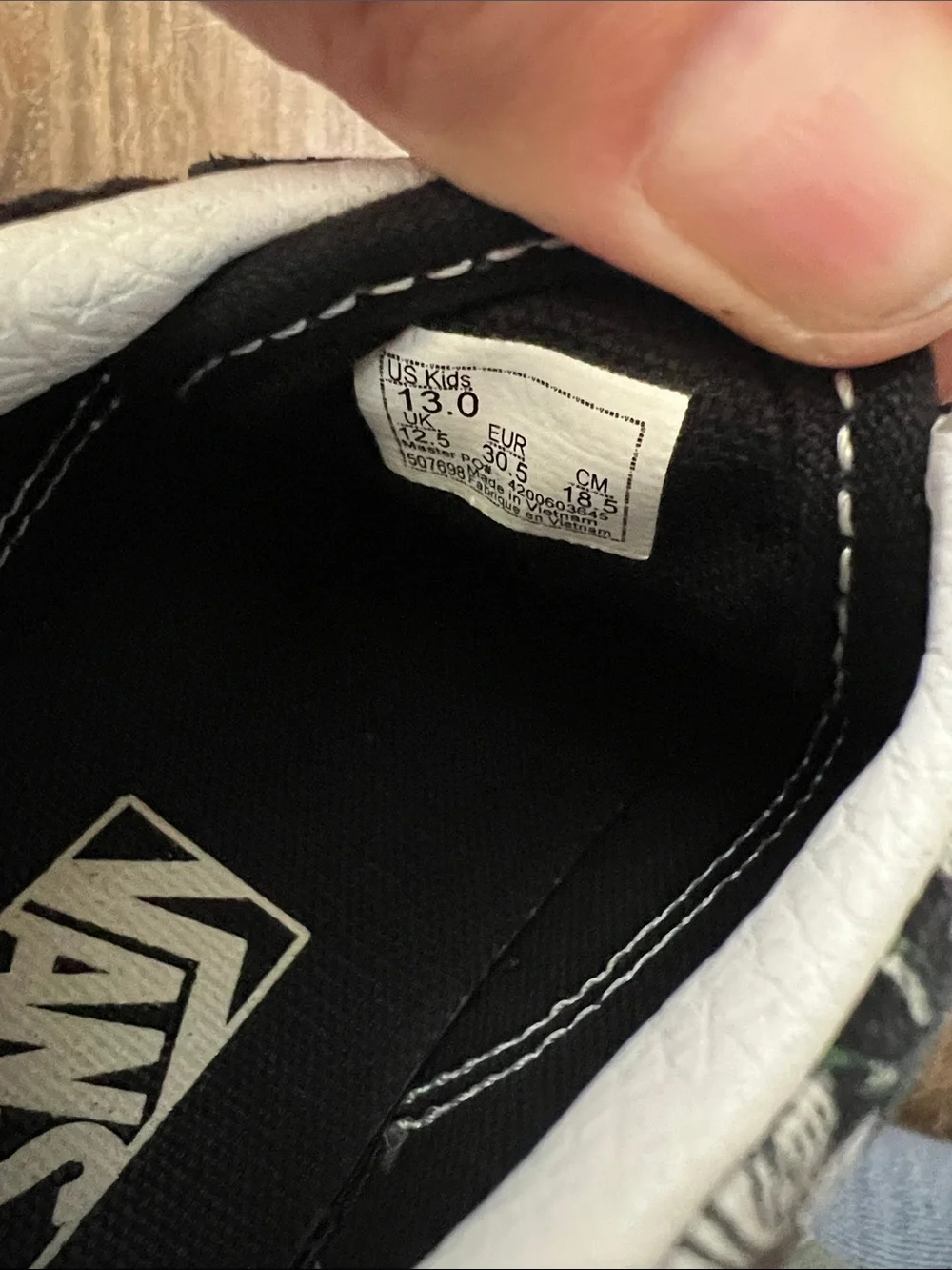 Vans Kids Black Daisy Pattern Sneakers with White Stripe